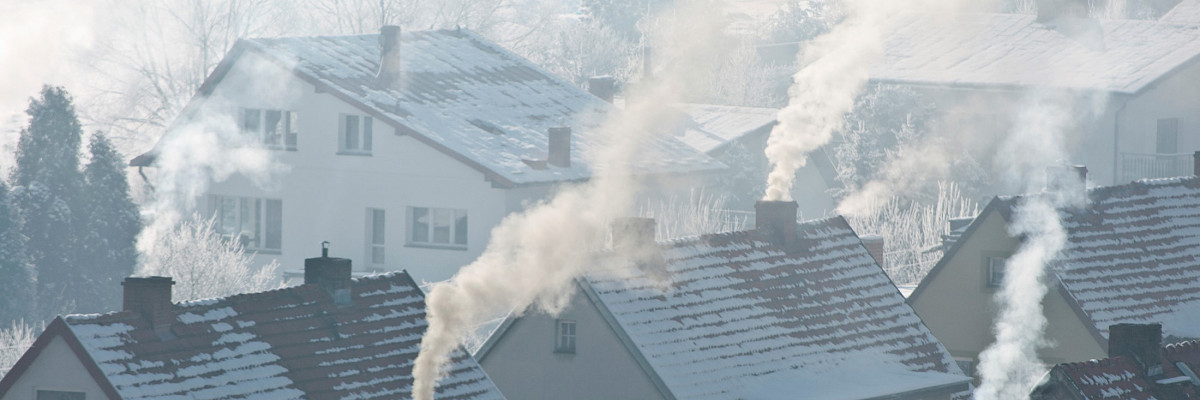 Soot arising from chimneys in residential area