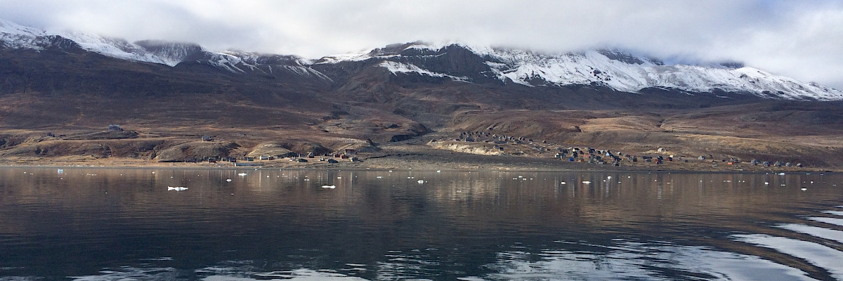 Boat view of Qullissat, Greenland – the birthplace of Kuupik Kleist, one of the three Pikialasorsuaq Commissioners.