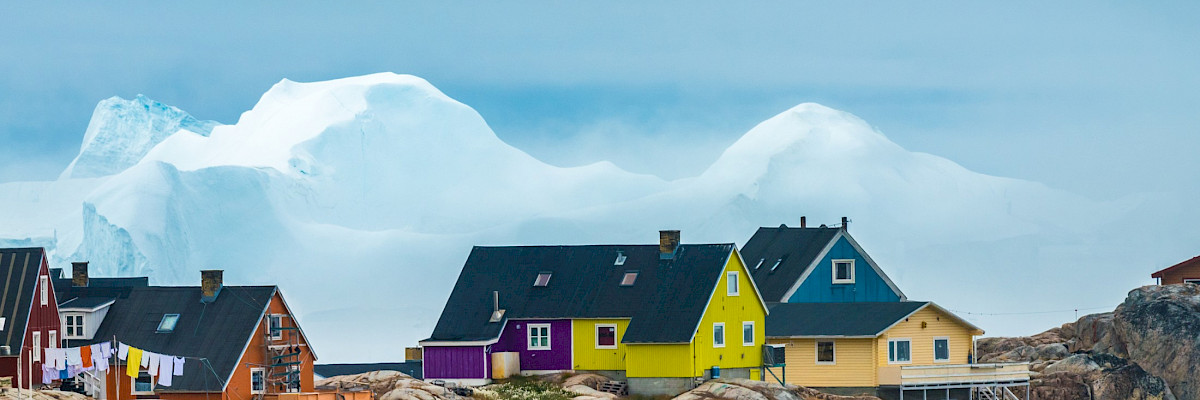 The city of Iulissat with stranded icebergs in the background, Greenland
